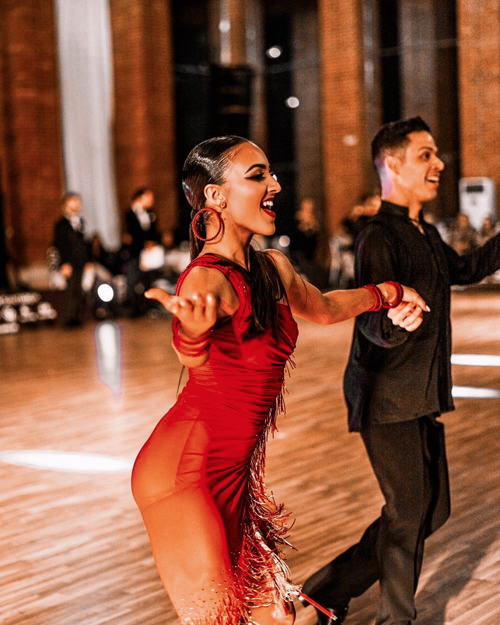 Christina Katsaros performing in red